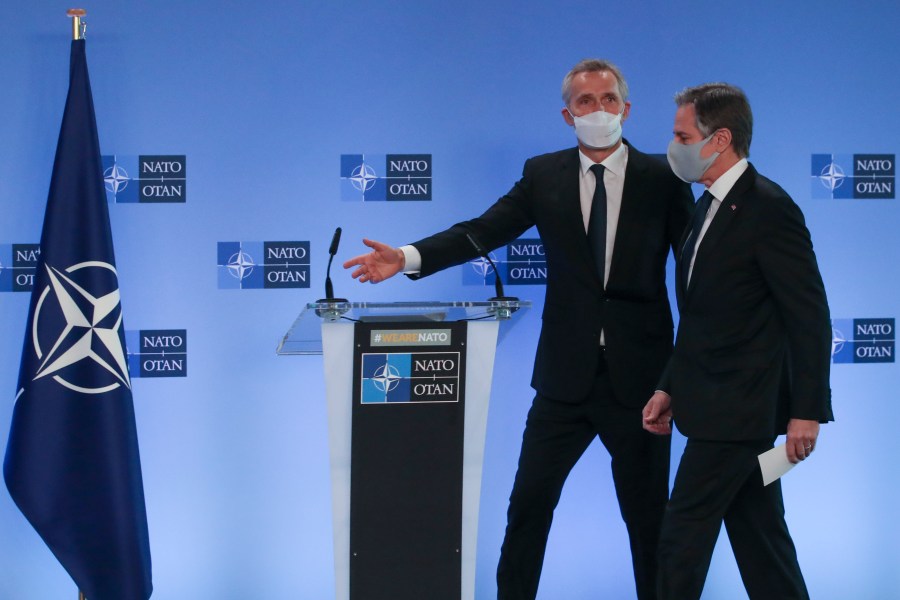 U.S. Secretary of State Antony Blinken, right, and NATO Secretary General Jens Stoltenberg arrive to give remarks prior to a NATO foreign ministers meeting at NATO headquarters in Brussels, Tuesday, March 23, 2021. (Yves Herman, Pool via AP)