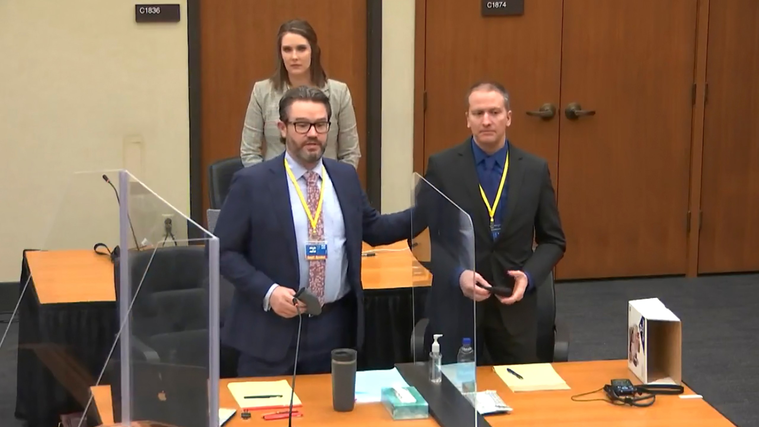 In this screen grab from video, defense attorney Eric Nelson, left, defendant and former Minneapolis police officer Derek Chauvin, right, and Nelson's assistant Amy Voss, back, introduce themselves to potential jurors as Hennepin County Judge Peter Cahill Tuesday, March 23, 2021, presides over jury selection in the trial of Chauvin at the Hennepin County Courthouse in Minneapolis, Minn. Chauvin is charged in the May 25, 2020 death of George Floyd. (Court TV, via AP, Pool)