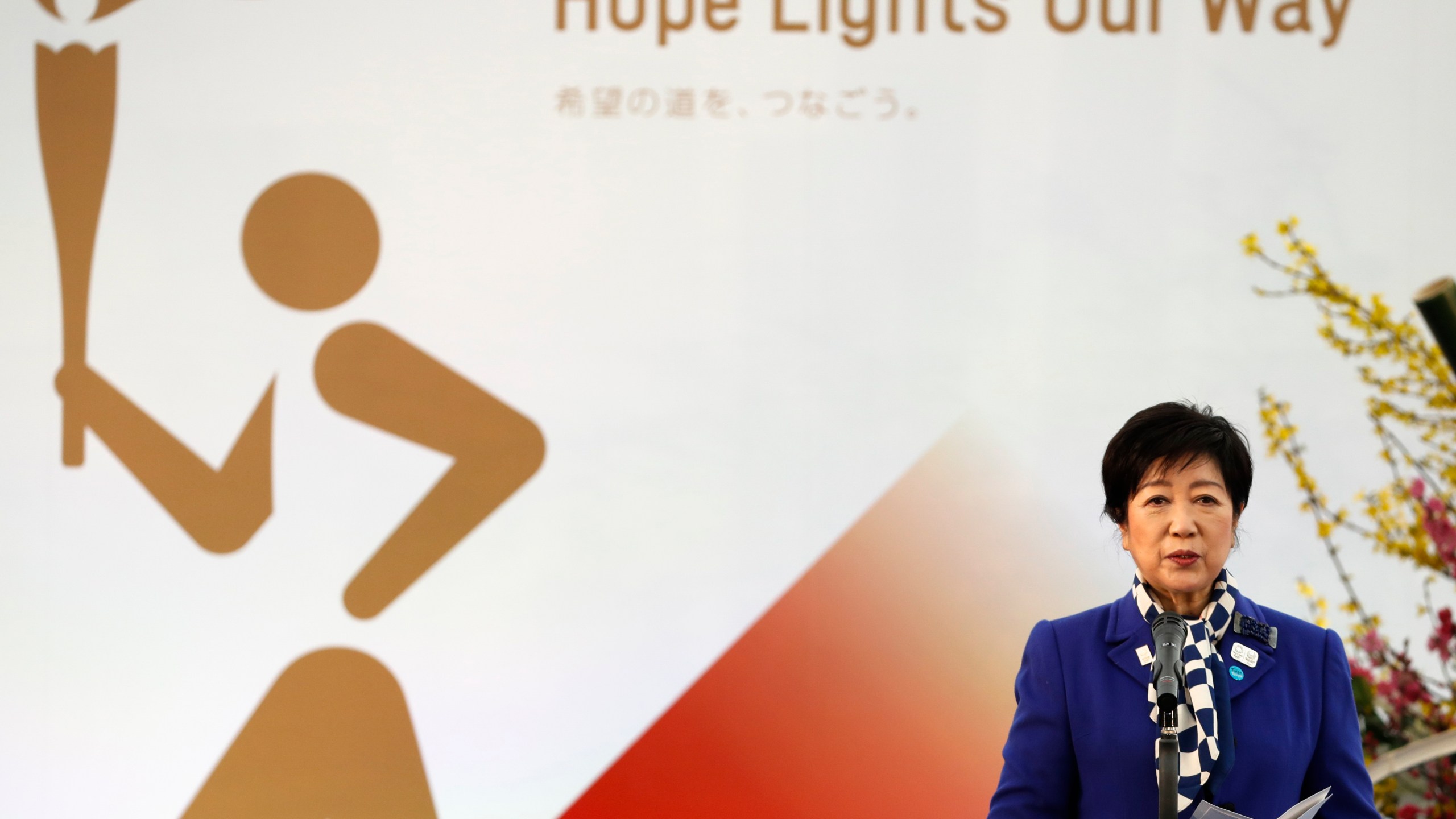 Tokyo Gov. Yuriko Koike delivers a speech during the Grand Start of the Olympic Torch Relay in Naraha, Fukushima prefecture, northeastern Japan, Thursday, March 25, 2021. (Kim Kyung-Hoon/Pool Photo via AP)