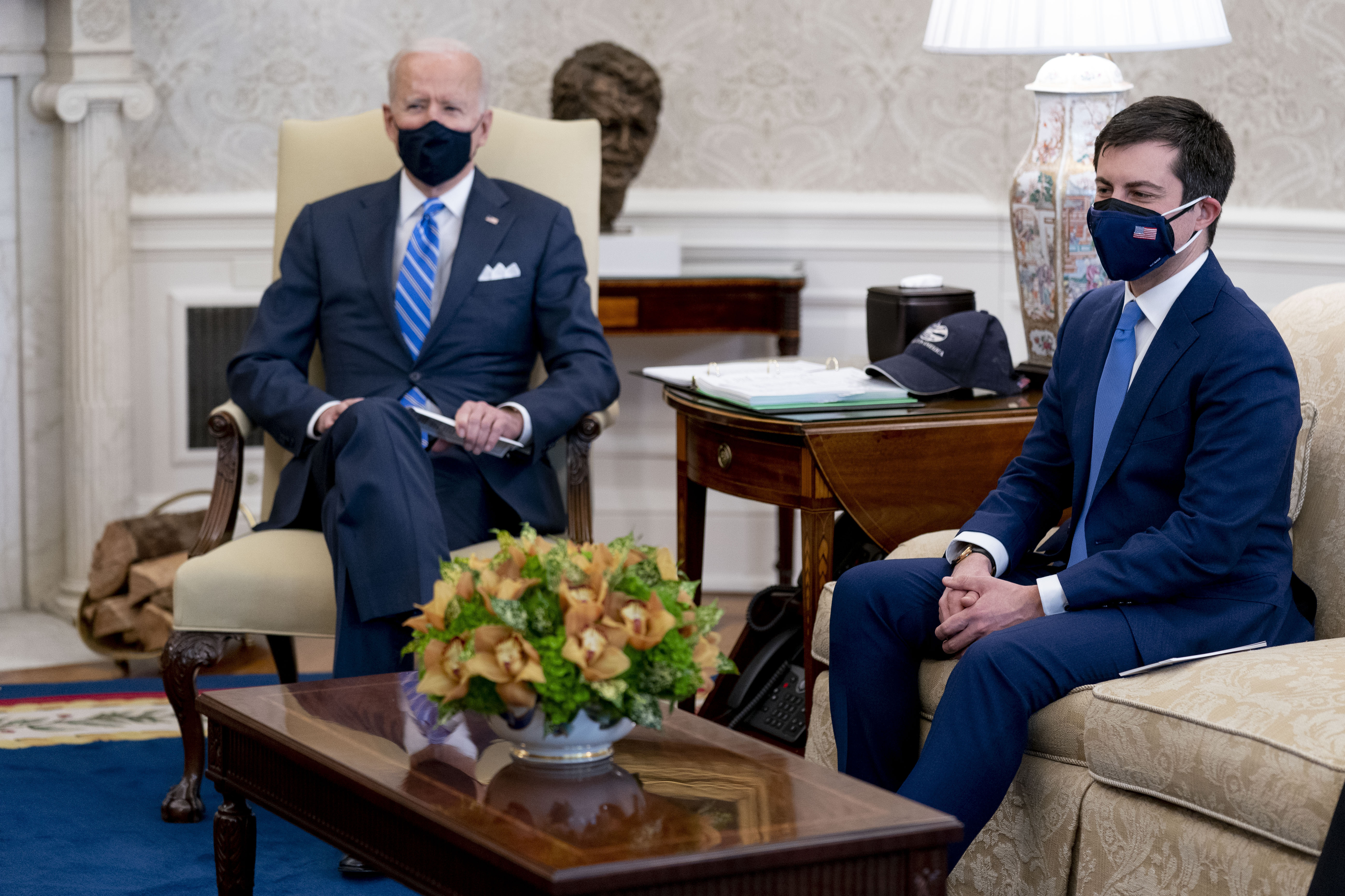 President Joe Biden and Transportation Secretary Pete Buttigieg, right, meet with Vice President Kamala Harris and members of the House of Representatives in the Oval Office of the White House on March 4, 2021.(Andrew Harnik / Associated Press)