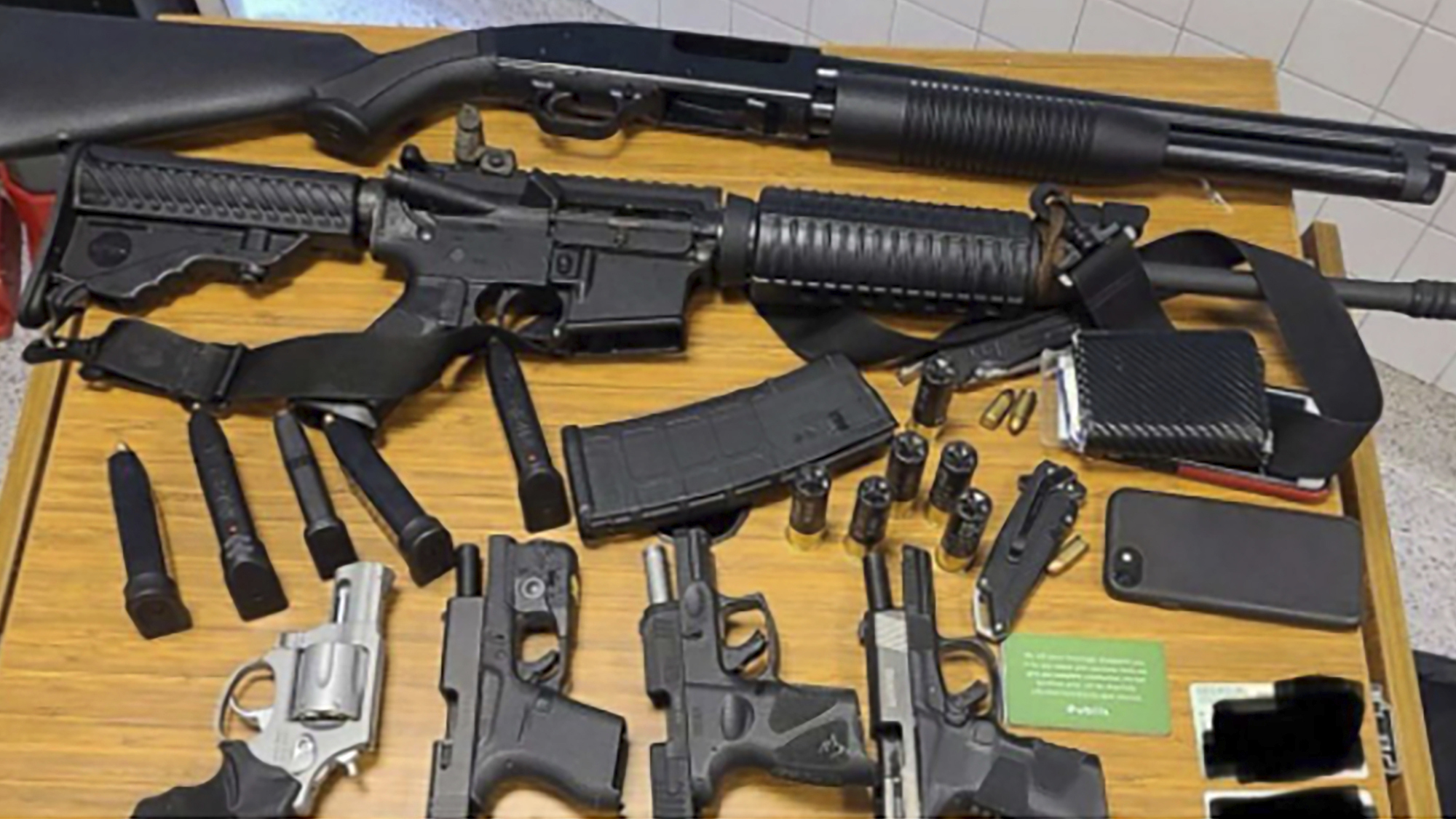 This photo provided by the Atlanta Police Department shows weapons Rico Marley was armed with at the time of his arrest on Wednesday, March 24, 2021. Authorities say Marley, who walked into an Atlanta grocery store with multiple guns and body armor, was spotted by a witness who immediately became suspicious and alerted management. (Atlanta Police Department via AP)