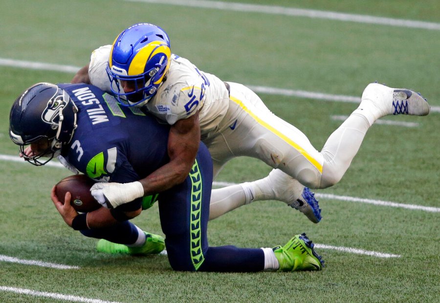 In this Dec. 27, 2020, file photo, Seattle Seahawks quarterback Russell Wilson (3) is sacked by Los Angeles Rams outside linebacker Leonard Floyd (54) during the first half of an NFL football game in Seattle. (AP Photo/Scott Eklund, File)