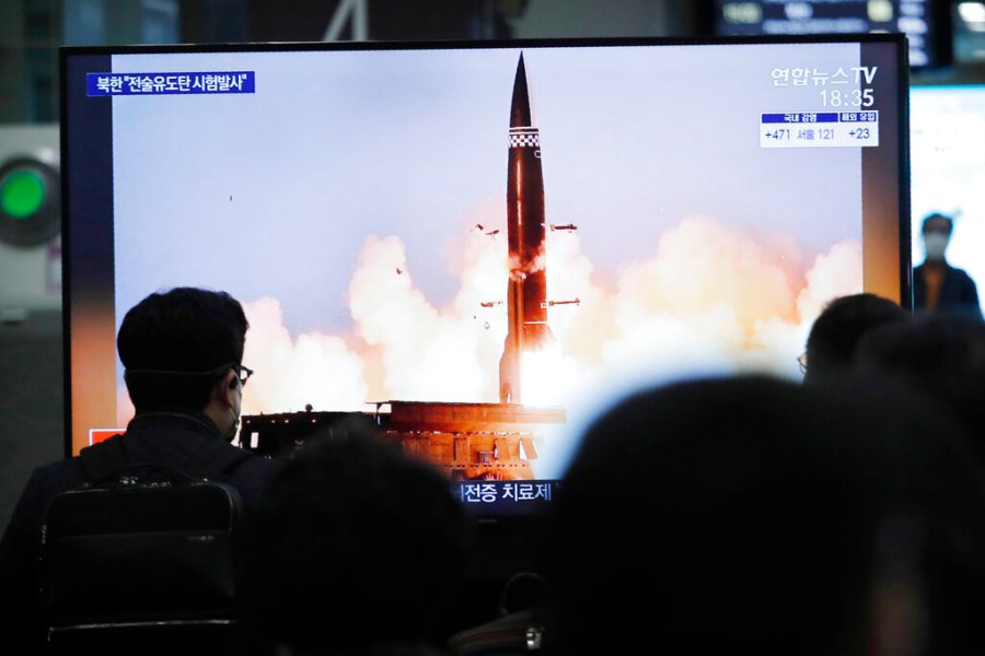 People watch a TV showing an image of North Korea's new guided missile during a news program at the Suseo Railway Station in Seoul, South Korea, Friday. March 26, 2021. (AP Photo/Ahn Young-joon)