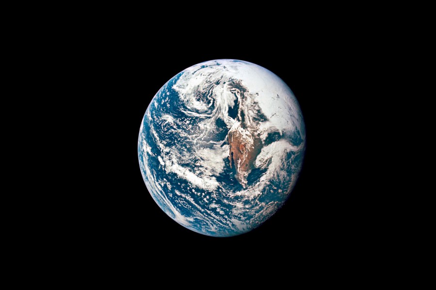 This May 18, 1969 photo made available by NASA shows Earth from 36,000 nautical miles away as photographed from the Apollo 10 spacecraft during its trans-lunar journey toward the moon. In March 2021, the U.S. space agency announced that new telescope observations have ruled out any chance of the asteroid Apophis colliding with Earth in 2068. (NASA via AP)