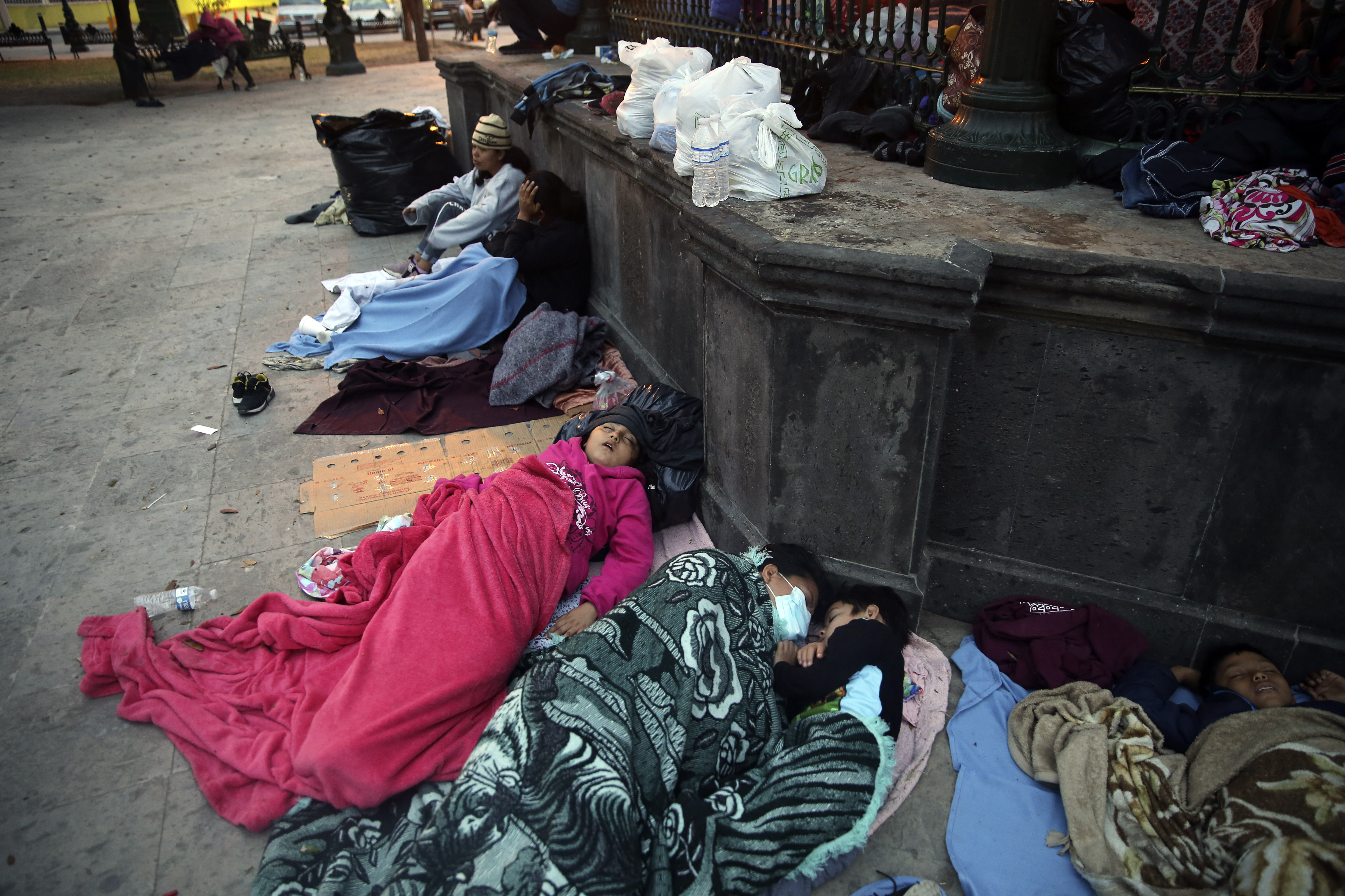 Migrants sleep under a gazebo at a park in the Mexican border city of Reynosa, Saturday, March 27, 2021. (AP Photo/Dario Lopez-Mills)