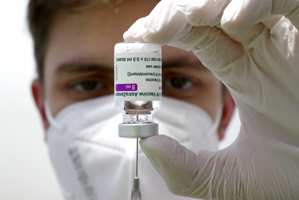 In this file photo dated Monday, March 22, 2021, medical staff prepares a syringe from a vial of the AstraZeneca coronavirus vaccine during preparations at the vaccine center in Ebersberg near Munich, Germany. (AP Photo/Matthias Schrader, FILE)