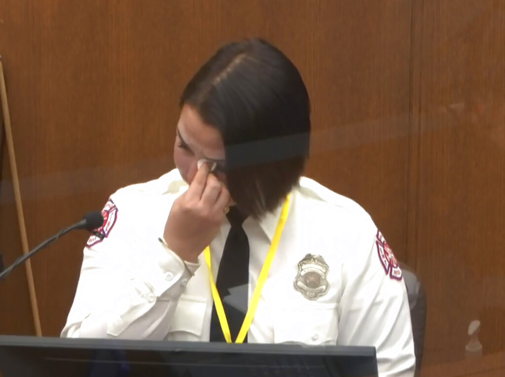 In this image from video, Minneapolis Firefighter Genevieve Hansen wipes her eyes as she testifies Tuesday, March 30, 2021, in the trial of former Minneapolis police Officer Derek Chauvin. (Court TV via AP, Pool)