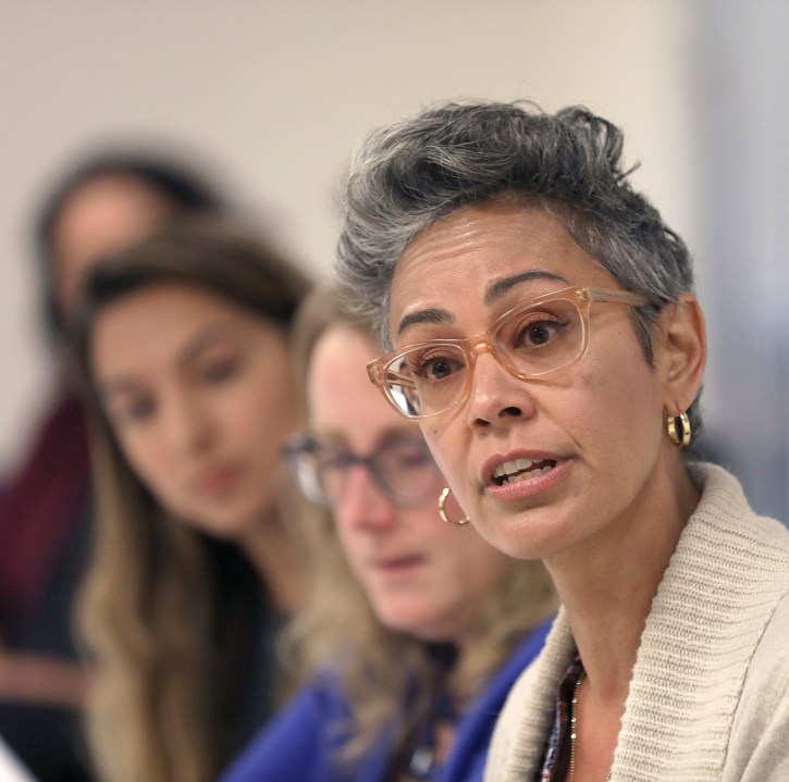 In this Sept. 26, 2018 file photo, Alison Collins, right, is seen during an editorial board meeting in San Francisco. (Liz Hafalia/San Francisco Chronicle via AP, File)