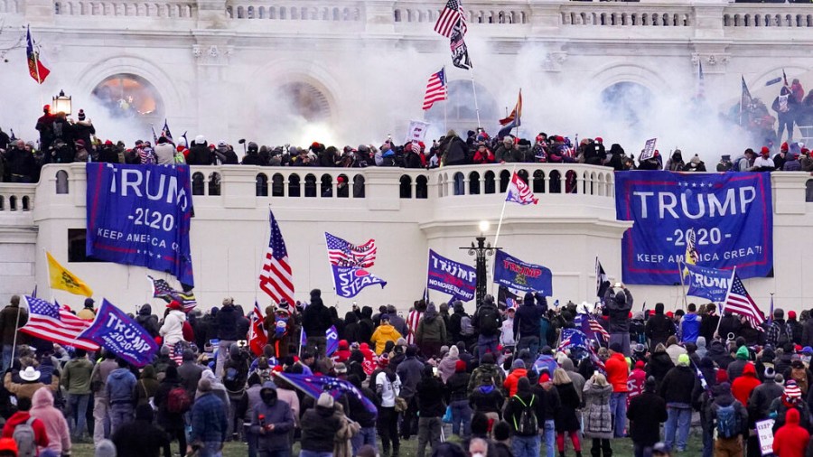 In this Jan. 6, 2021 file photo rioters supporting President Donald Trump storm the Capitol in Washington. (AP Photo/John Minchillo, File)