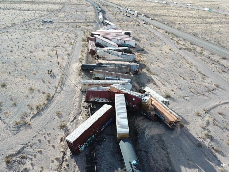 This photo released by the San Bernardino County Fire Department shows a derailed cargo train in the desert east of Ludlow that sent more than two dozen rail cars crashing into the sand on March 3, 2021.