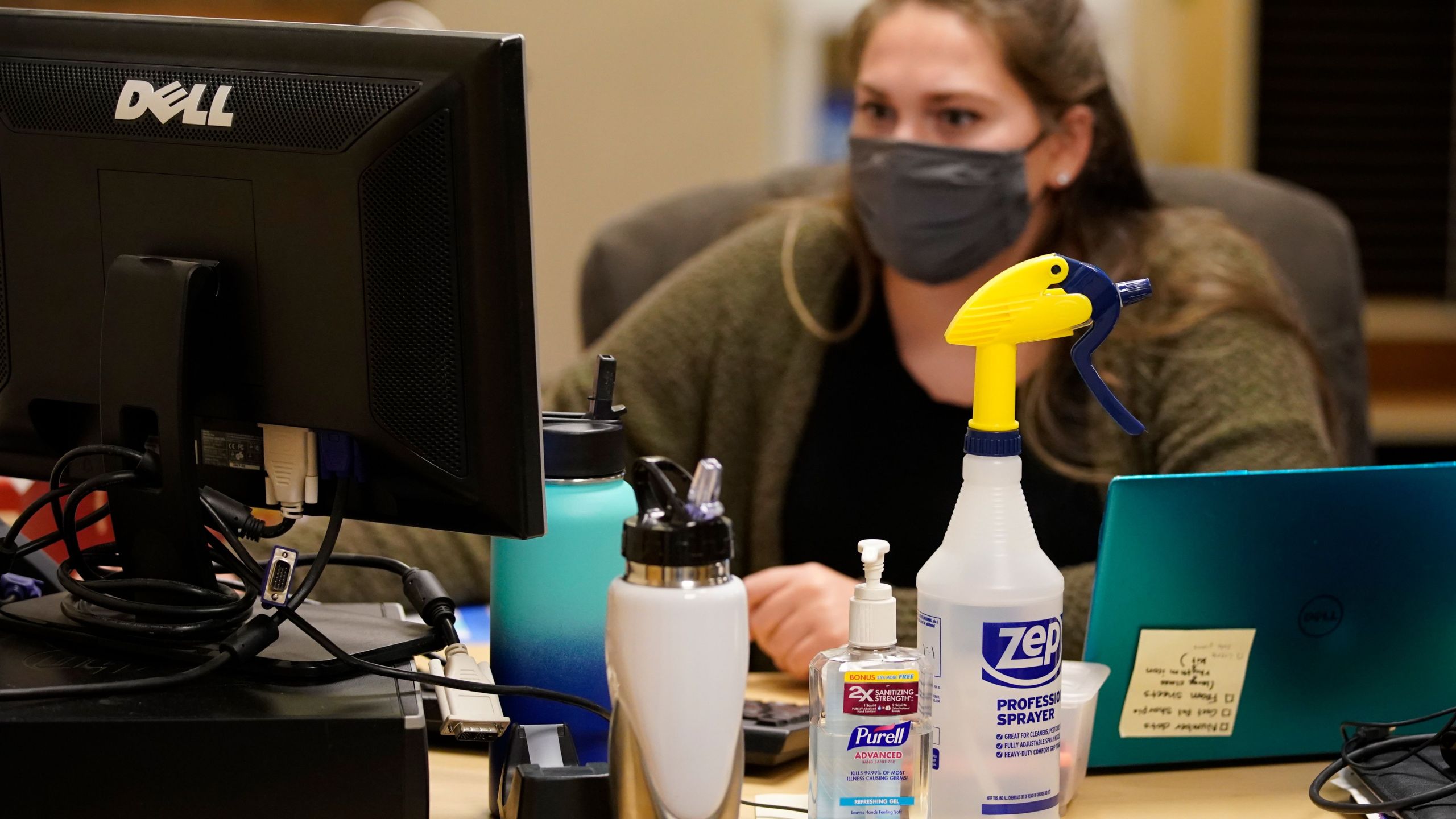 Hand sanitizer and other cleaning products sit on a teachers desk at Freedom Preparatory Academy on September 10, 2020 in Provo, Utah. (GEORGE FREY/AFP via Getty Images)