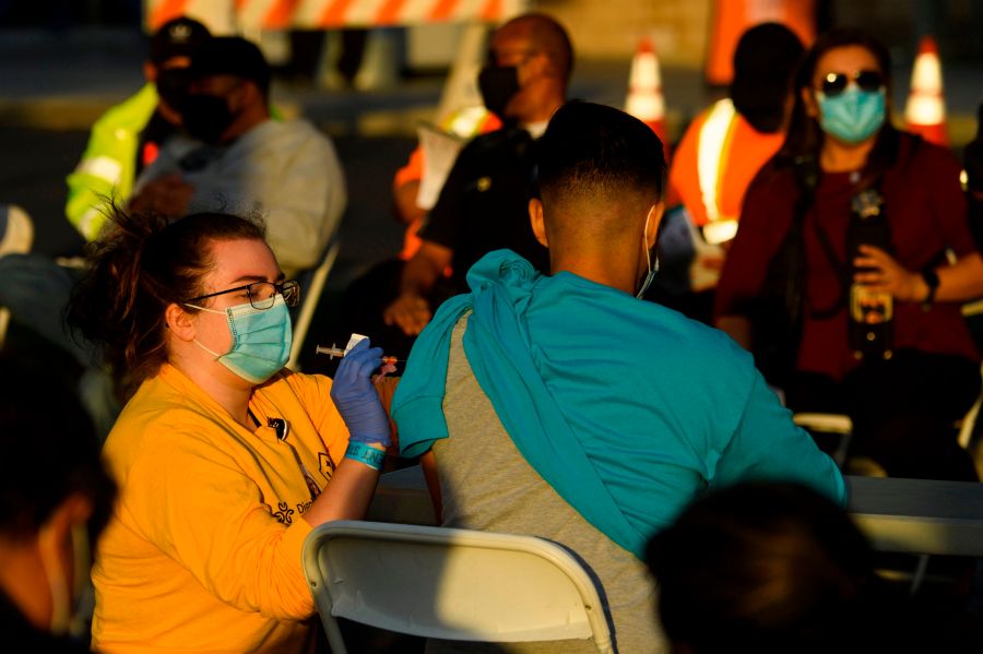 A nurse administers a dose of the Moderna COVID-19 vaccine at a vaccination site at Dignity Health Sports Park on Feb. 6, 2021, in Carson, California. (PATRICK T. FALLON/AFP via Getty Images)