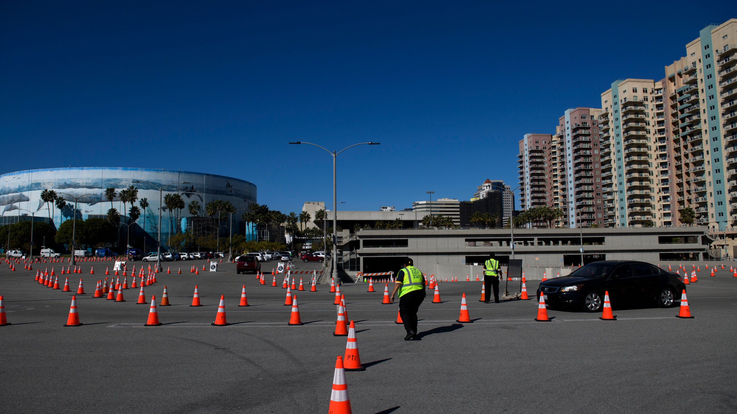 Vehicles drive to a post-vaccine recovery area after at a COVID-19 vaccination site on Feb.22, 2021 in Long Beach. (PATRICK T. FALLON/AFP via Getty Images)