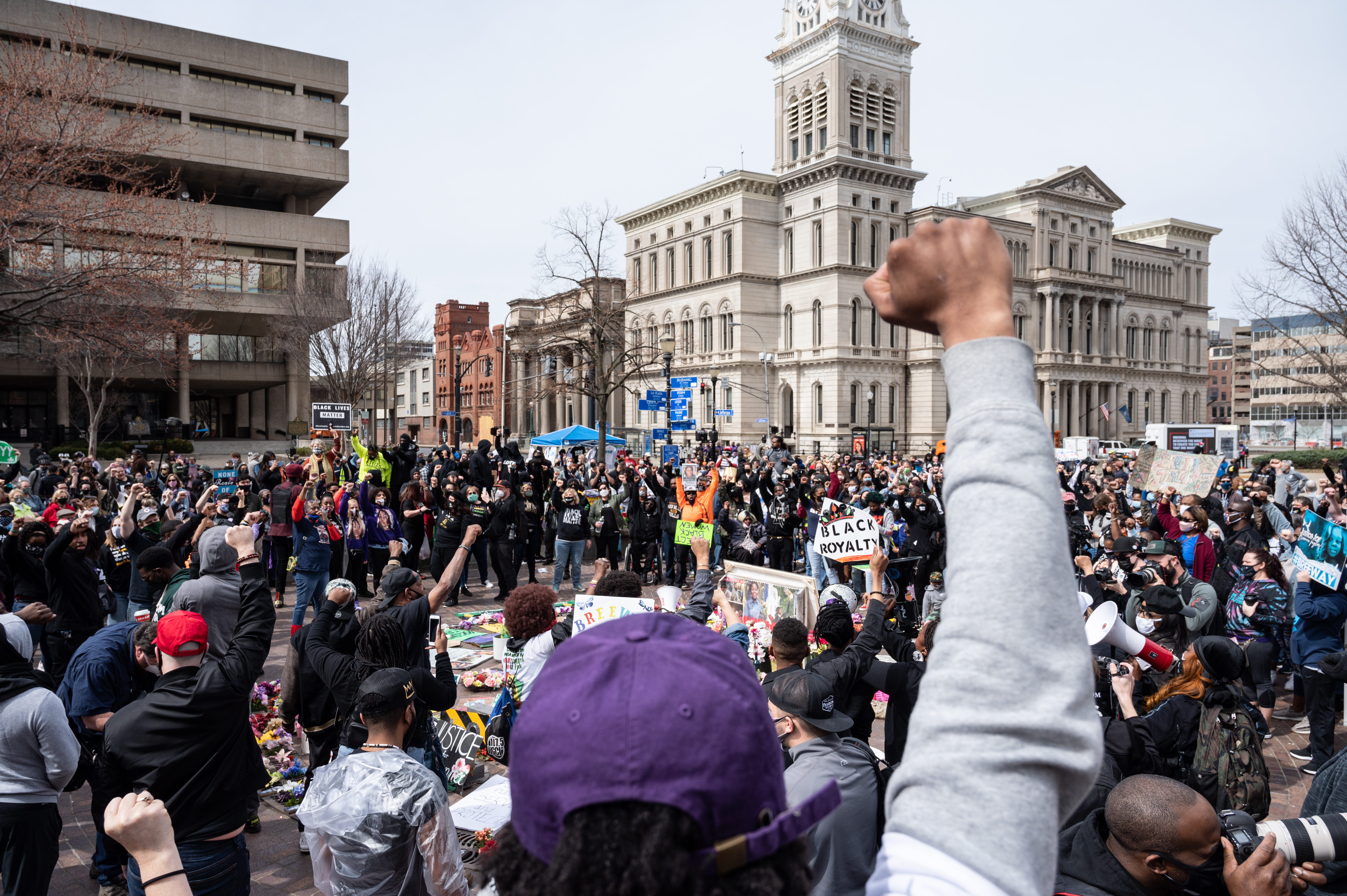 A protest organizer raises his fist toward the crowd during a Breonna Taylor memorial protest in Jefferson Square Park on March 13, 2021 in Louisville, Kentucky. (Jon Cherry/Getty Images)