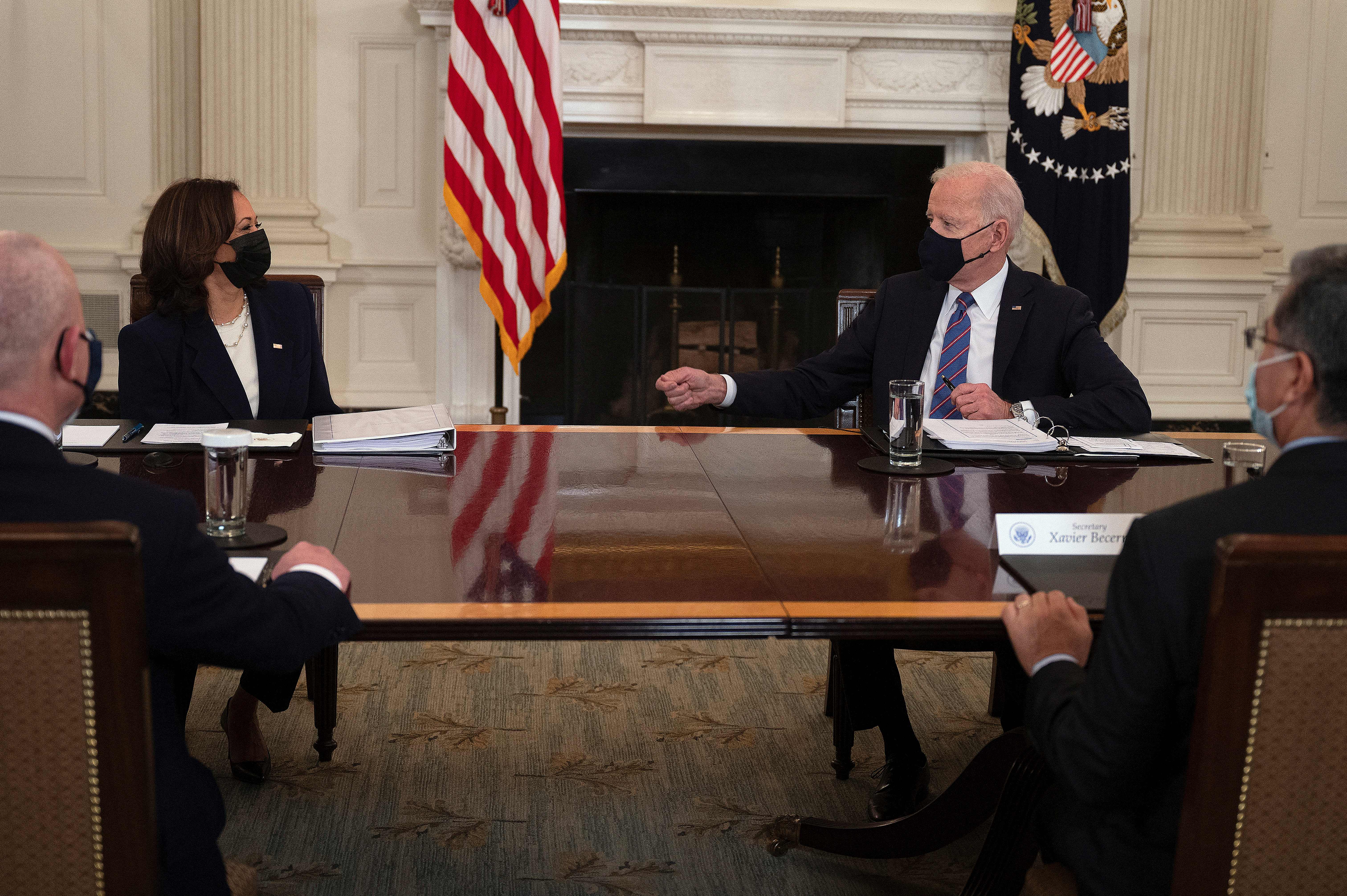 President Joe Biden and Vice President Kamala Harris meet with Secretary of Health and Human Services Xavier Becerra (front R) and Secretary of Homeland Security, Alejandro Mayorkas (Front L) on March 24, 2021. (JIM WATSON/AFP via Getty Images)