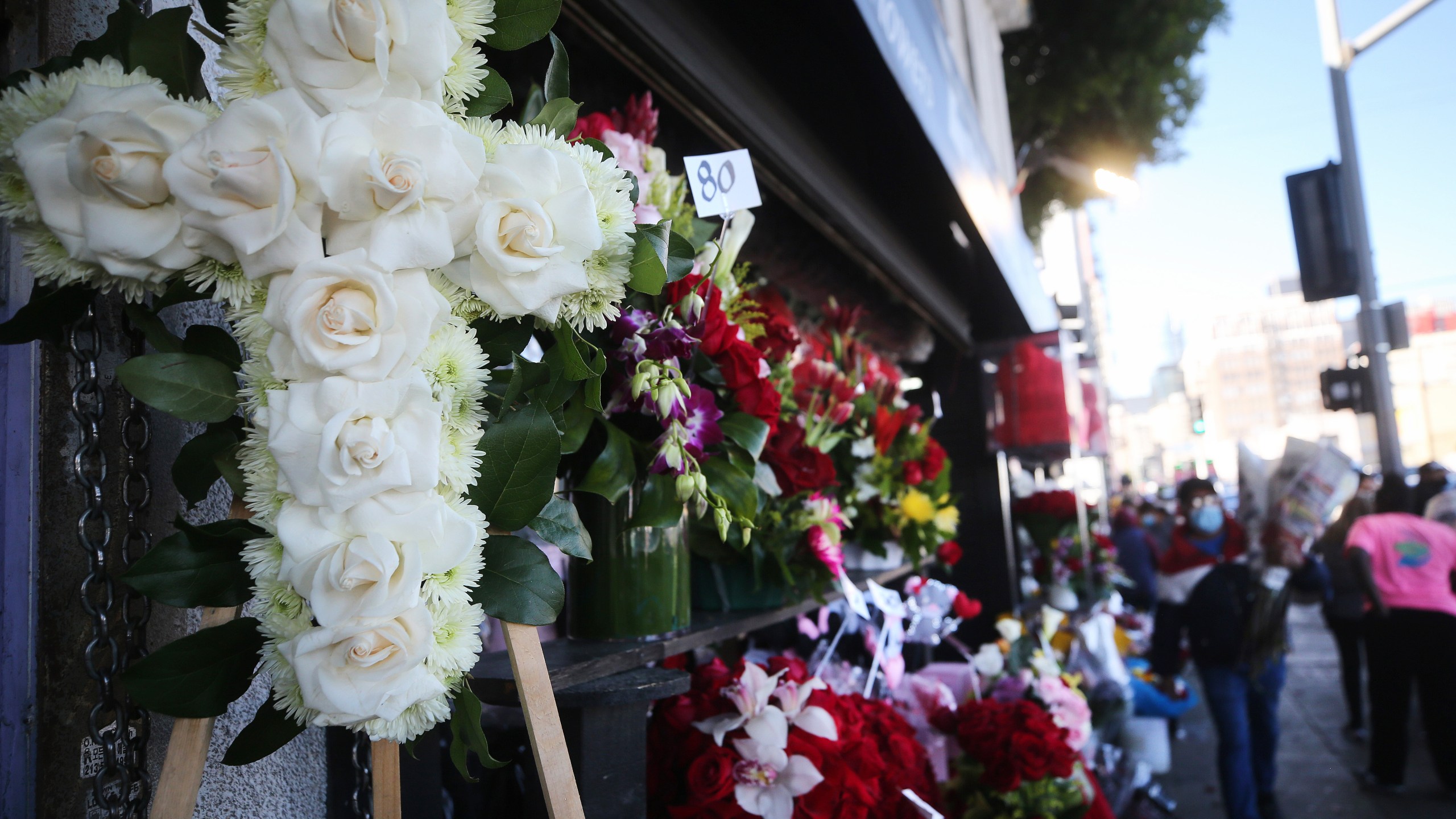 A floral cross for a funeral is displayed for sale in the flower district two days before Valentine's Day amid the COVID-19 pandemic on February 12, 2021 in Los Angeles, California. (Photo by Mario Tama/Getty Images)