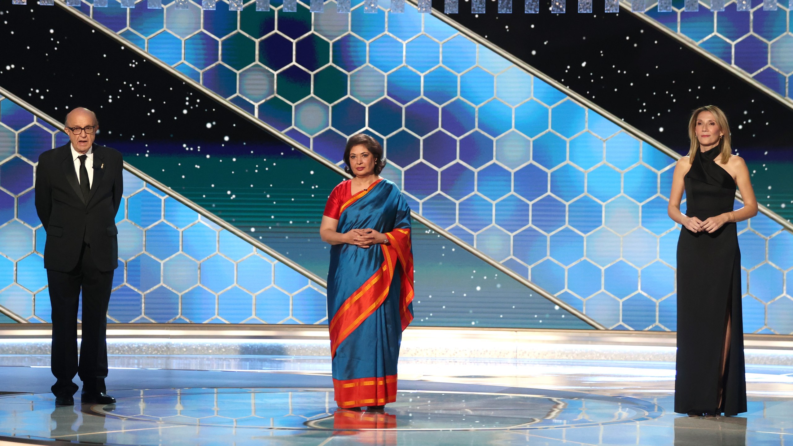 Pictured in this image released on Fen. 28, 2021, are (l-r) HFPA President Ali Sar, HFPA Board Chair Meher Tatna, and HFPA Vice President Helen Hoehne speak onstage at the 78th Annual Golden Globe Awards held at The Beverly Hilton and broadcast on Feb. 28, 2021, in Beverly Hills. (Christopher Polk/NBC/NBCU Photo Bank via Getty Images)