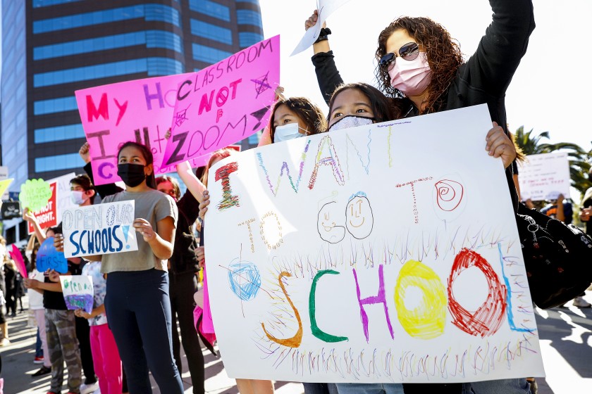 Protesters outside the West L.A. Federal Building last week urged the L.A. Unified School District to bring students back for in-person instruction.(Christina House / Los Angeles Times)