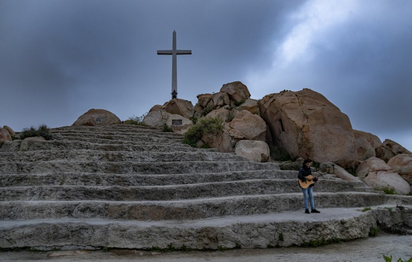 Guitarist Javon Jones of the Antioch Church sings gospel hymns during a livestreamed Easter service on Mt. Rubidoux on April 12, 2020, in Riverside. (Gina Ferazzi / Los Angeles Times)