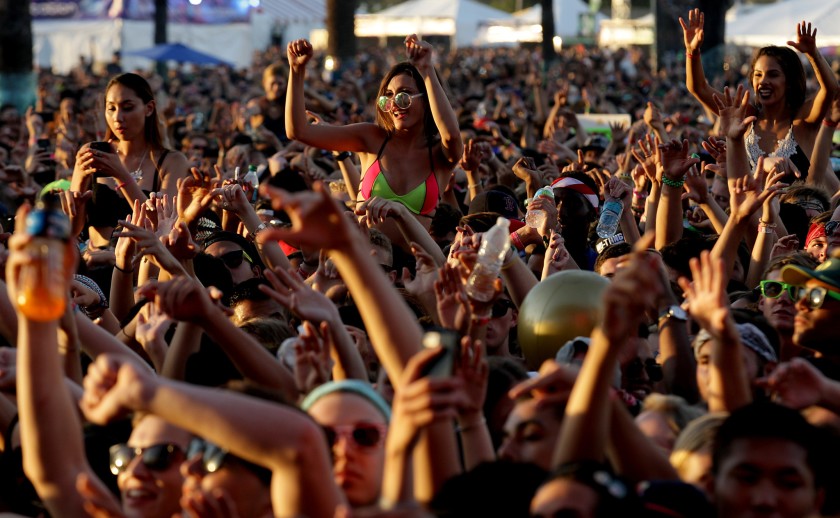 Fans at Hard Summer music festival in San Bernardino in 2016, when social distancing was a concept most of us couldn’t imagine. (Luis Sinco / Los Angeles Times)