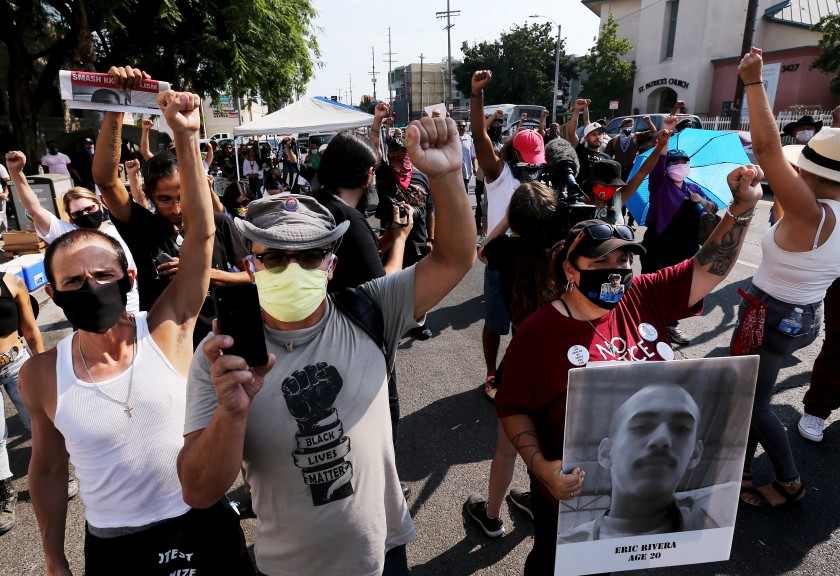 Families and friends of people who were fatally shot by the LAPD rallied Aug. 22 outside Newton Station in South Los Angeles. (Luis Sinco / Los Angeles Times)