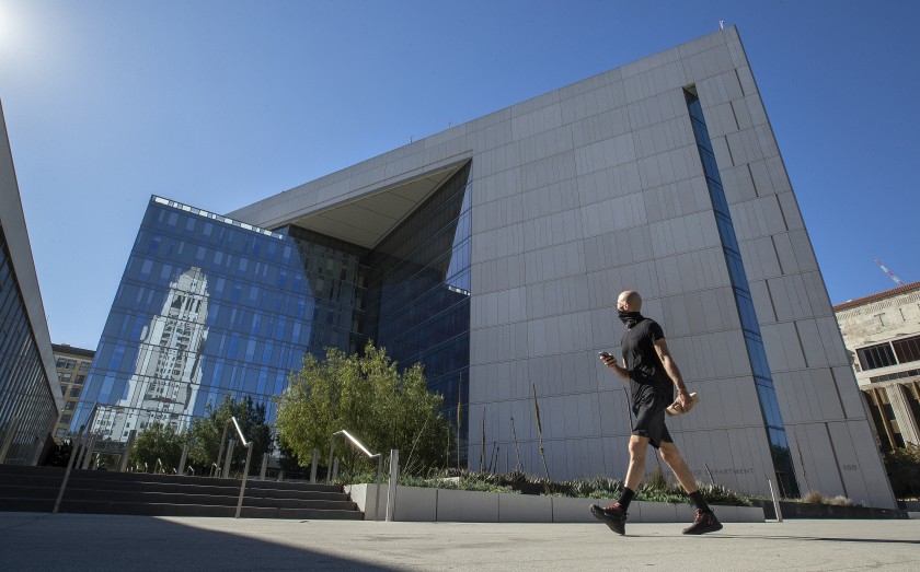 LAPD officials said an officer had been assigned home after his gun went off at a house party over the weekend. The headquarters for the Los Angeles Police Department is shown in November 2020 in downtown. (Mel Melcon/Los Angeles Times)