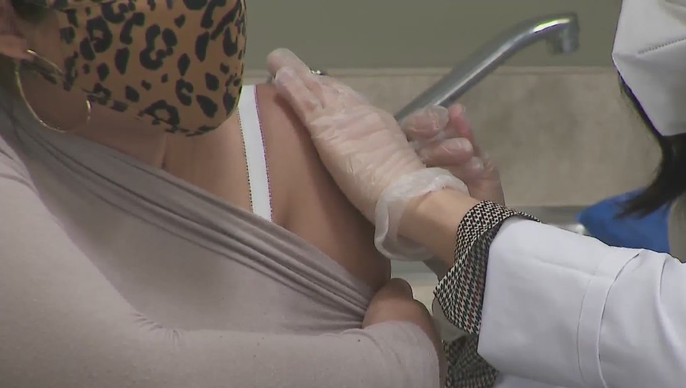 A woman receives a vaccine shot at a clinic in La Puente on March 16, 2021. (KTLA)