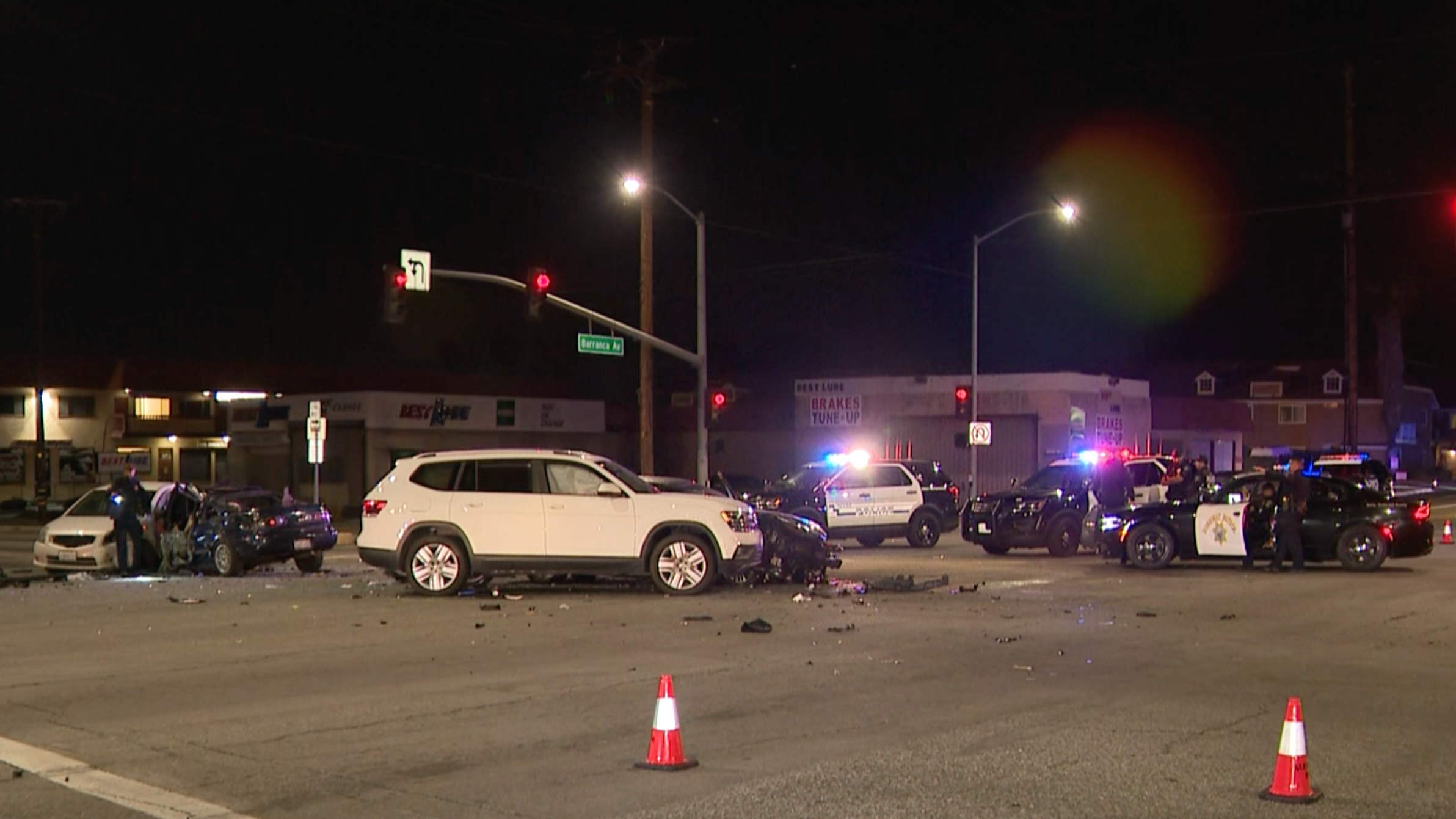 Authorities investigate the scene of a chain-reaction crash involving a stolen vehicle being chased by police in the Covina area on March 8, 2021. (KTLA)