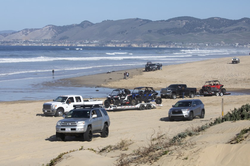 Vehicles drive on the sand at Oceano Dunes State Vehicular Recreation Area in this undated photo. Two state agencies are at odds over the future of the off-road riding area. (Myung J. Chun/Los Angeles Times)