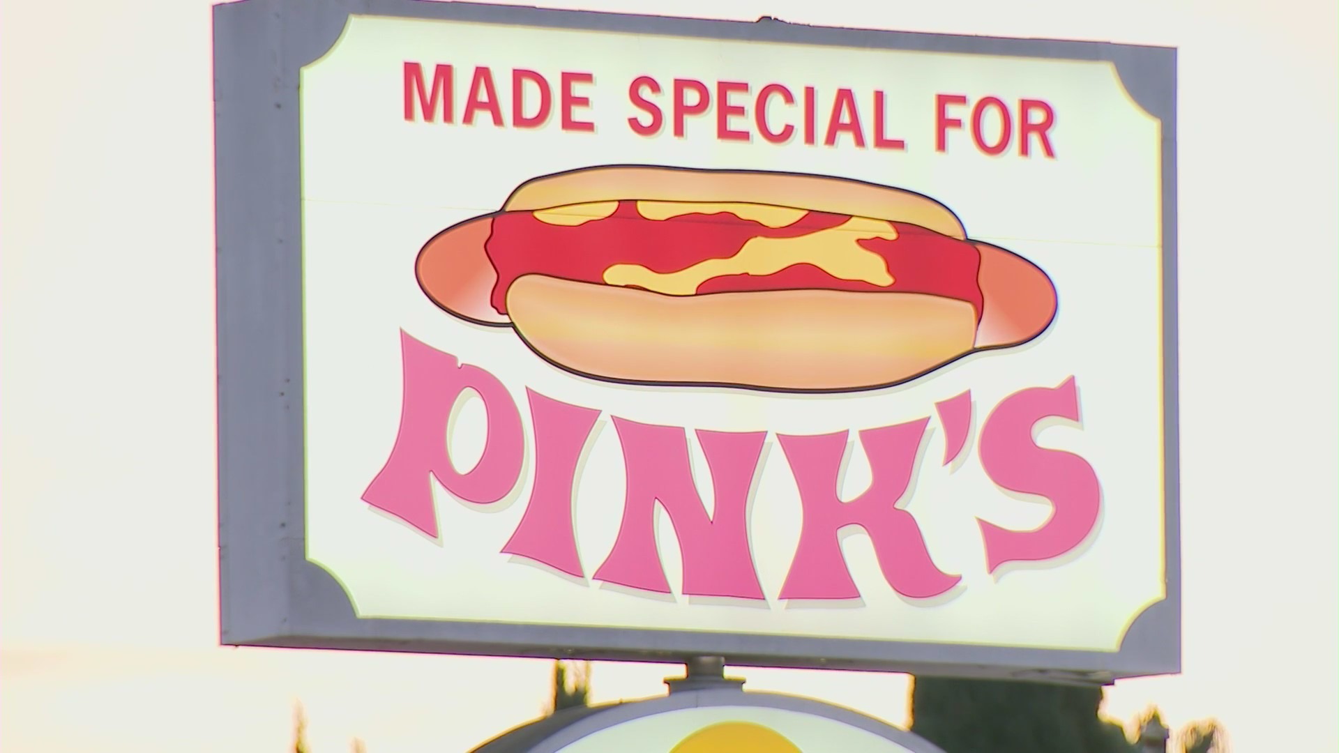 A sign for the iconic Pink's hot dog stand is seen in this image taken from video. (KTLA)