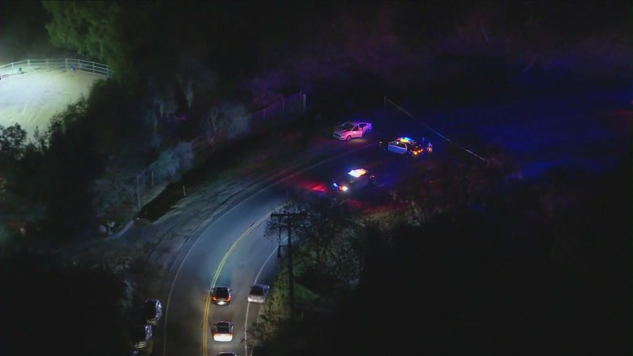 Topanga Canyon Boulevard is blocked off following a deadly hit-and-run crash near Woodland Hills on March 3, 2021. (KTLA)