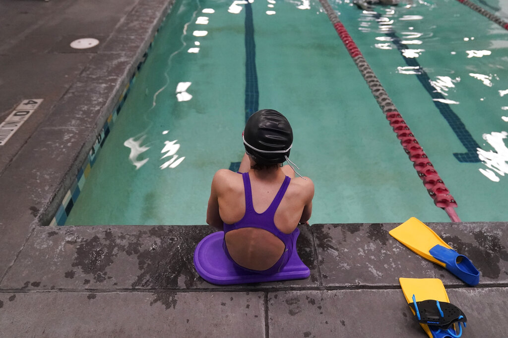 A proposed ban on transgender athletes playing female school sports in Utah would affect transgender girls like this 12-year-old swimmer. She and her family spoke with The Associated Press on the condition of anonymity to avoid outing her publicly. She cried when she heard about the proposal that would ban transgender girls from competing on girls’ sports teams in public high schools, which would separate her from her friends. She’s far from the tallest girl on her team, and has worked hard to improve her times but is not a dominant swimmer in her age group, her coach said. “Other than body parts I’ve been a girl my whole life,” she said. (AP Photo/Rick Bowmer)