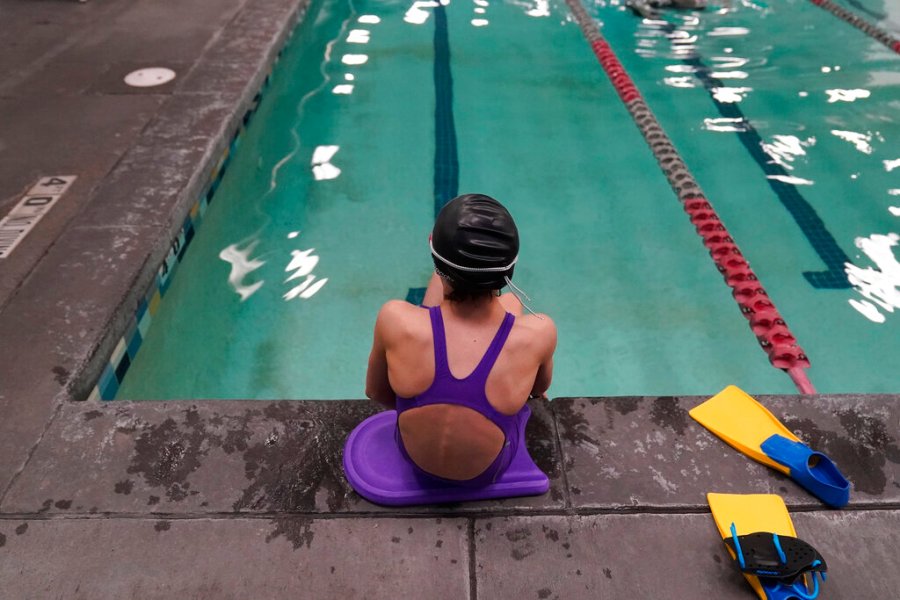 A proposed ban on transgender athletes playing female school sports in Utah would affect transgender girls like this 12-year-old swimmer. She and her family spoke with The Associated Press on the condition of anonymity to avoid outing her publicly. She cried when she heard about the proposal that would ban transgender girls from competing on girls’ sports teams in public high schools, which would separate her from her friends. She’s far from the tallest girl on her team, and has worked hard to improve her times but is not a dominant swimmer in her age group, her coach said. “Other than body parts I’ve been a girl my whole life,” she said. (AP Photo/Rick Bowmer)