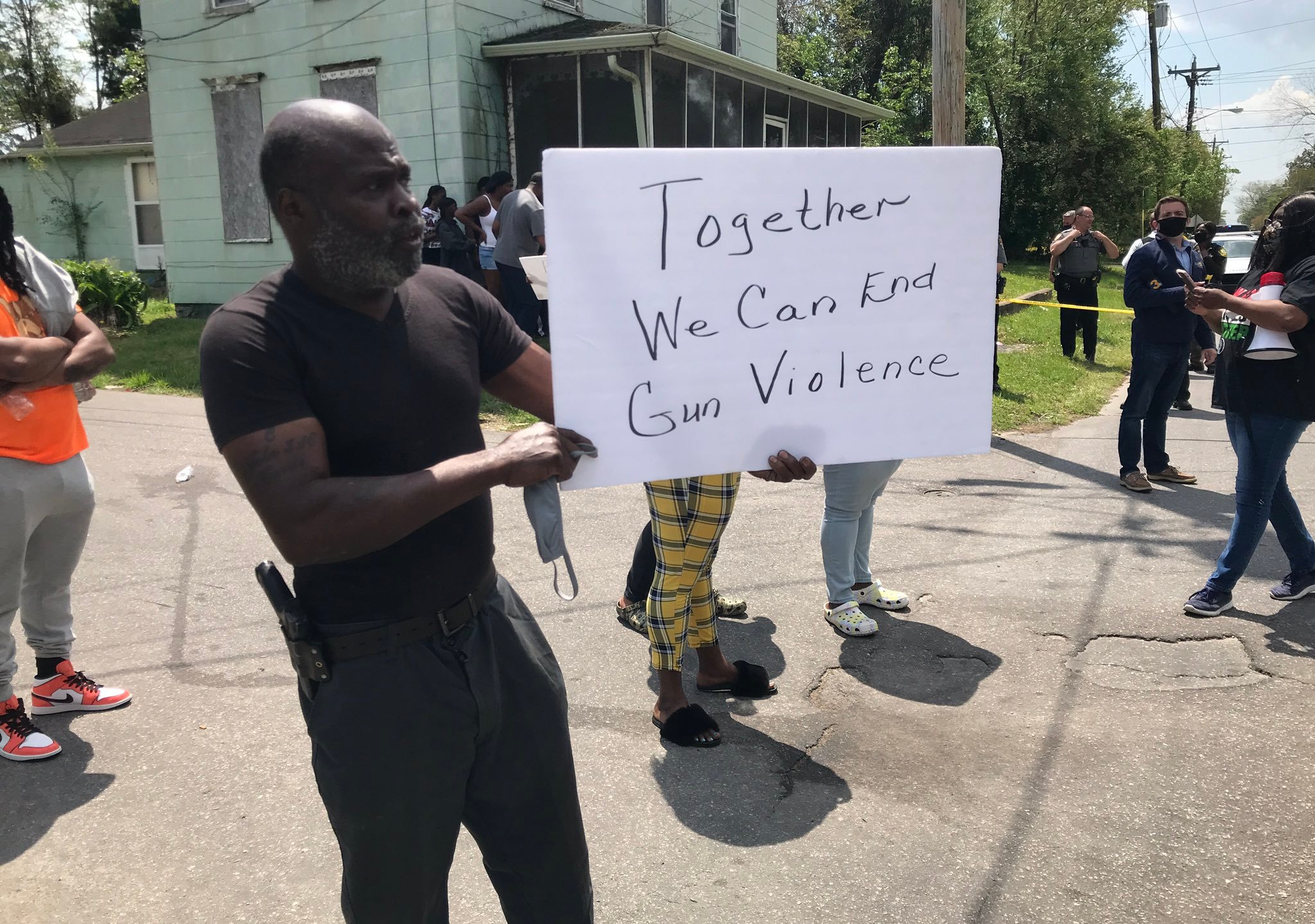 A demonstrator holds up a sign while protesting the shooting of a man by a sheriff's deputy in Elizabeth City, North Carolina, on April 21, 2021. (WAVY)