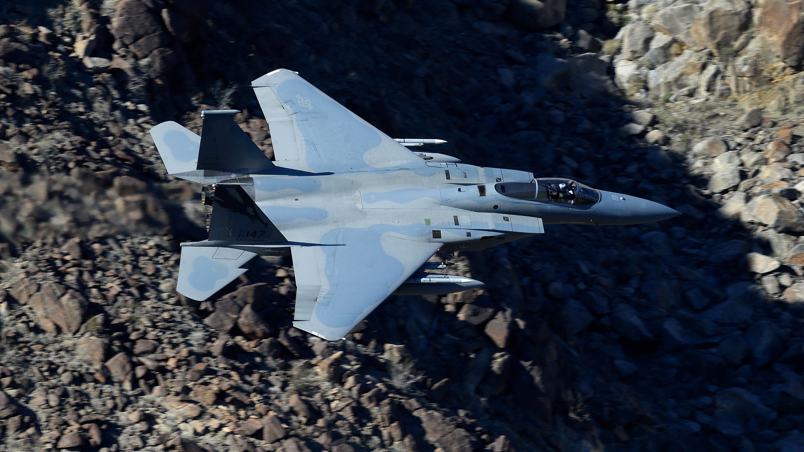 In this Feb. 28, 2017, photo, an F-15C Eagle from the California Air National Guard, 144th Fighter Wing, flies through the nicknamed Star Wars Canyon over Death Valley National Park, Calif. Sources told the L.A. Times that deploying an F-15C, an air-to-air combat jet based at the Guard’s 144th Fighter Wing in Fresno, to frighten demonstrators in this country would have been an inappropriate use of the military against U.S. civilians. (AP Photo/Ben Margot)