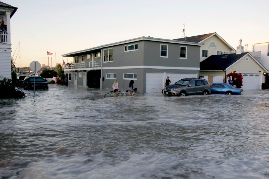 Streets in the Balboa Peninsula were flooded by coastal tides and high surf in Newport Beach, Calif., on July 3, 2020. (AP Photo/Matt Hartman)