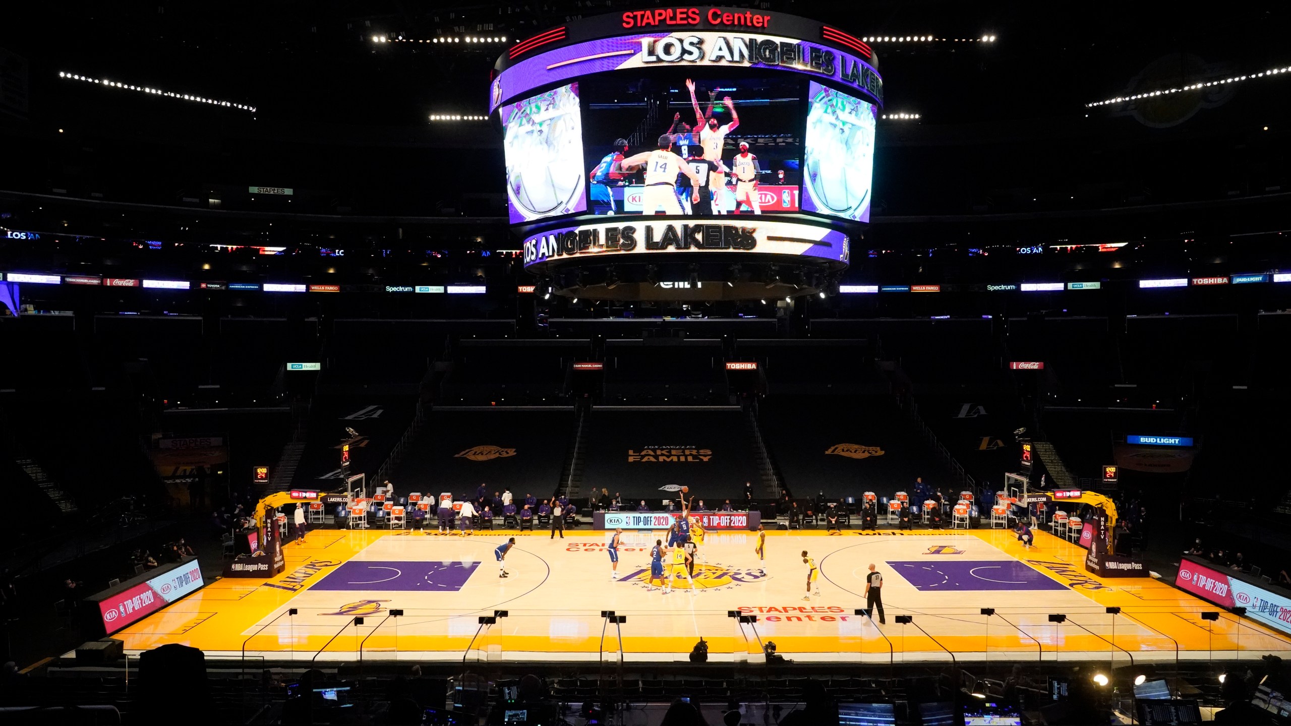 The Los Angeles Lakers and the Los Angeles Clippers tip off in an empty Staples Center amid the coronavirus pandemic, to start an NBA basketball game Dec. 22, 2020, in Los Angeles. (AP Photo/Marcio Jose Sanchez)