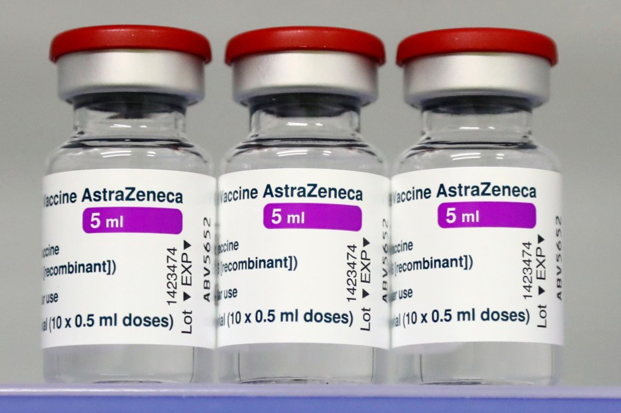 In this file photo dated Monday, March 22, 2021, vials of the AstraZeneca COVID-19 vaccine in a fridge at the local vaccine center in Ebersberg near Munich, Germany. German officials have decided to limit the use of AstraZeneca’s coronavirus vaccine in people under 60 after more unusual blood clots were reported in a small number of people who received the shots. Earlier this month, more than a dozen countries, including Germany, suspended their use of AstraZeneca over the blood clot issue. (AP Photo/Matthias Schrader, File)