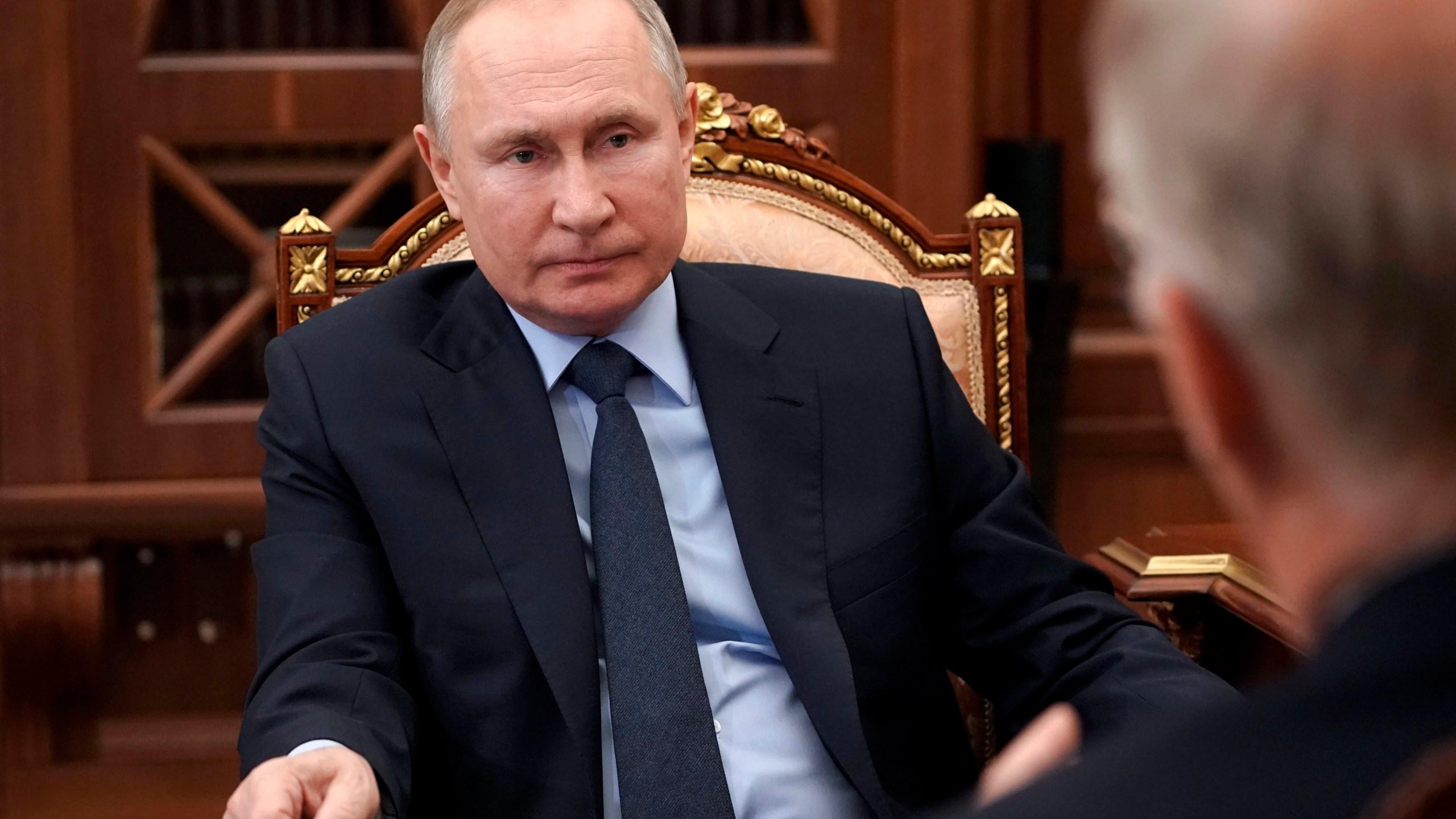 Russian President Vladimir Putin listens to General Director of the Russian Direct Investment Fund Krill Dmitriev at the Kremlin in Moscow, Russia, Friday, April 2, 2021. (Alexei Druzhinin, Sputnik, Kremlin Pool Photo via AP)