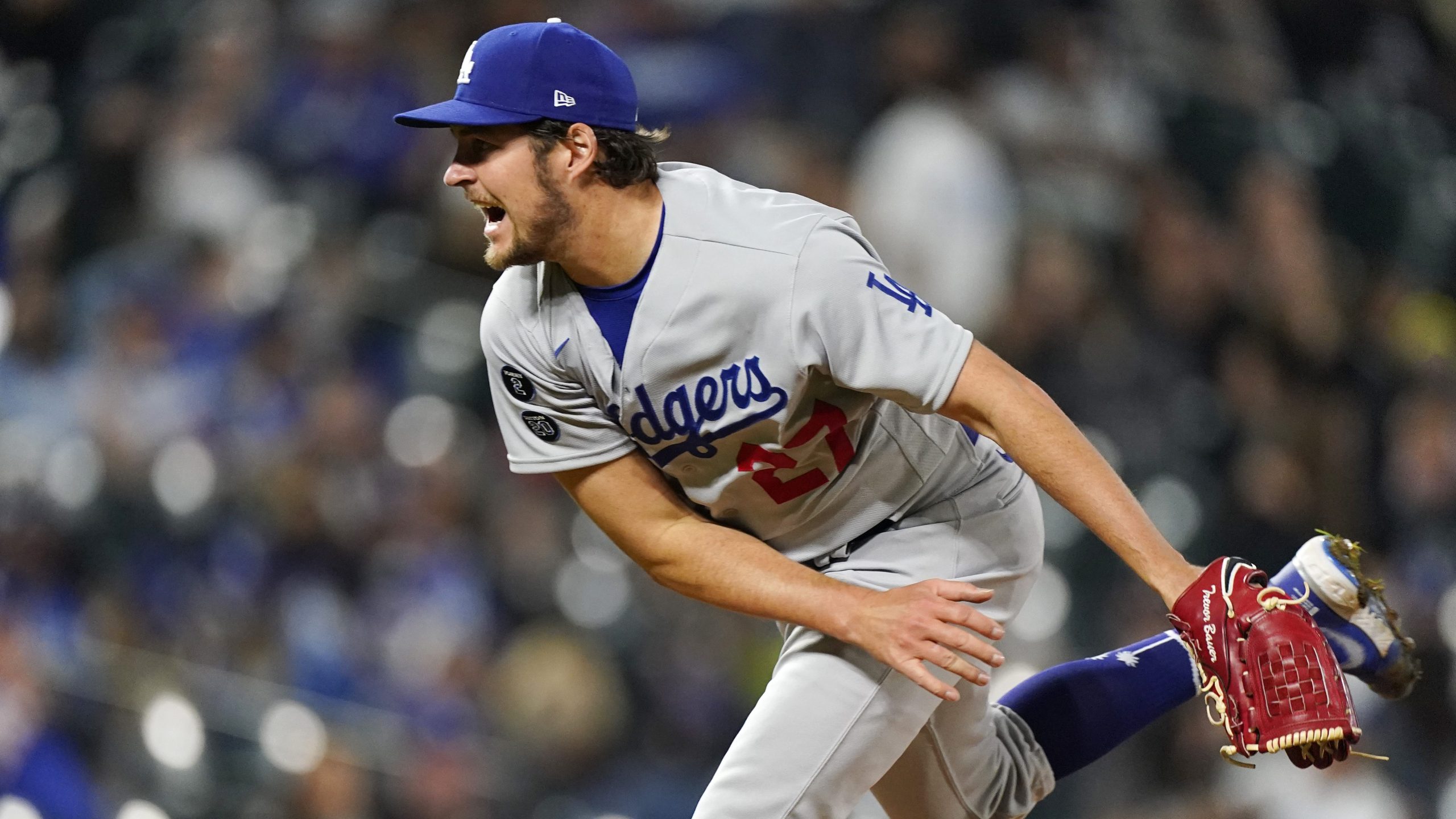 Los Angeles Dodgers starting pitcher Trevor Bauer works against the Colorado Rockies in the fifth inning of a baseball game in Denver on April 2, 2021. (David Zalubowski / Associated Press)