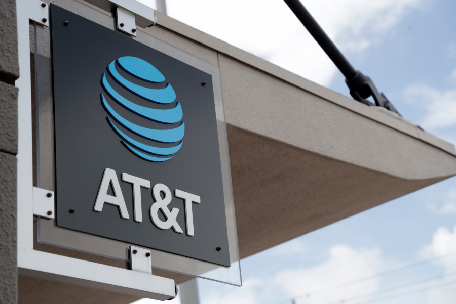 In this July 18, 2019, file photo, a sign is displayed at an AT&T retail store in Miami. (AP Photo/Lynne Sladky, File)