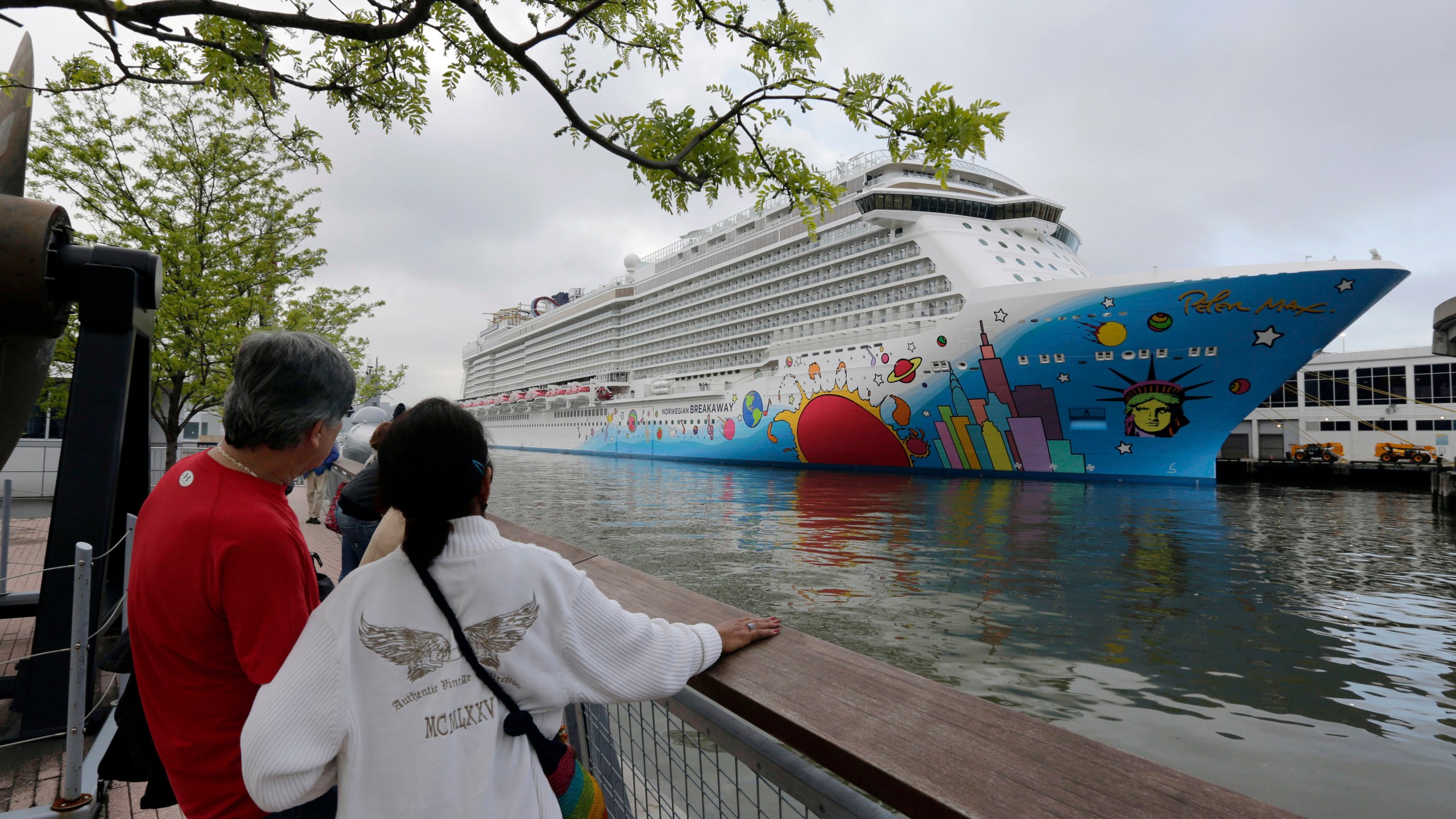 In this May 8, 2013, file photo, people pause to look at Norwegian Cruise Line's ship, Norwegian Breakaway, on the Hudson River, in New York. On Monday, April 5, 2021, Norwegian Cruise Line’s parent company asked the Centers for Disease Control and Prevention for permission to resume cruises from U.S. ports on July 4 by requiring passengers and crew members to be vaccinated against COVID-19 at least two weeks before the trip. (AP Photo/Richard Drew, File)