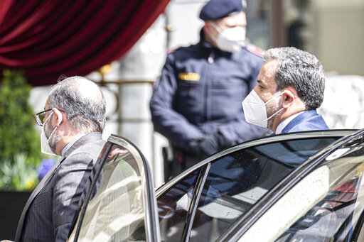 Political deputy at the Ministry of Foreign Affairs of Iran, Abbas Araghchi, right, arrives at the Grand Hotel Wien where closed-door nuclear talks with Iran take place in Vienna, Austria, Tuesday, April 6, 2021. (AP Photo/Florian Schroetter)