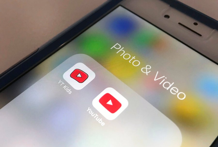 This April 25, 2018 file photo, the YouTube app and YouTube Kids app are displayed on an iPhone in New York. (AP Photo/Jenny Kane, File)