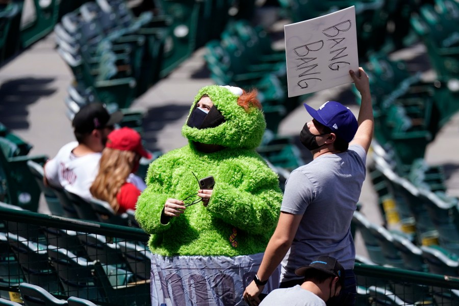 A fan wears an Oscar the Grouch costume as he taunts the Houston Astros prior to a baseball game against the Los Angeles Angels Tuesday, April 6, 2021, in Anaheim, Calif. (AP Photo/Mark J. Terrill)