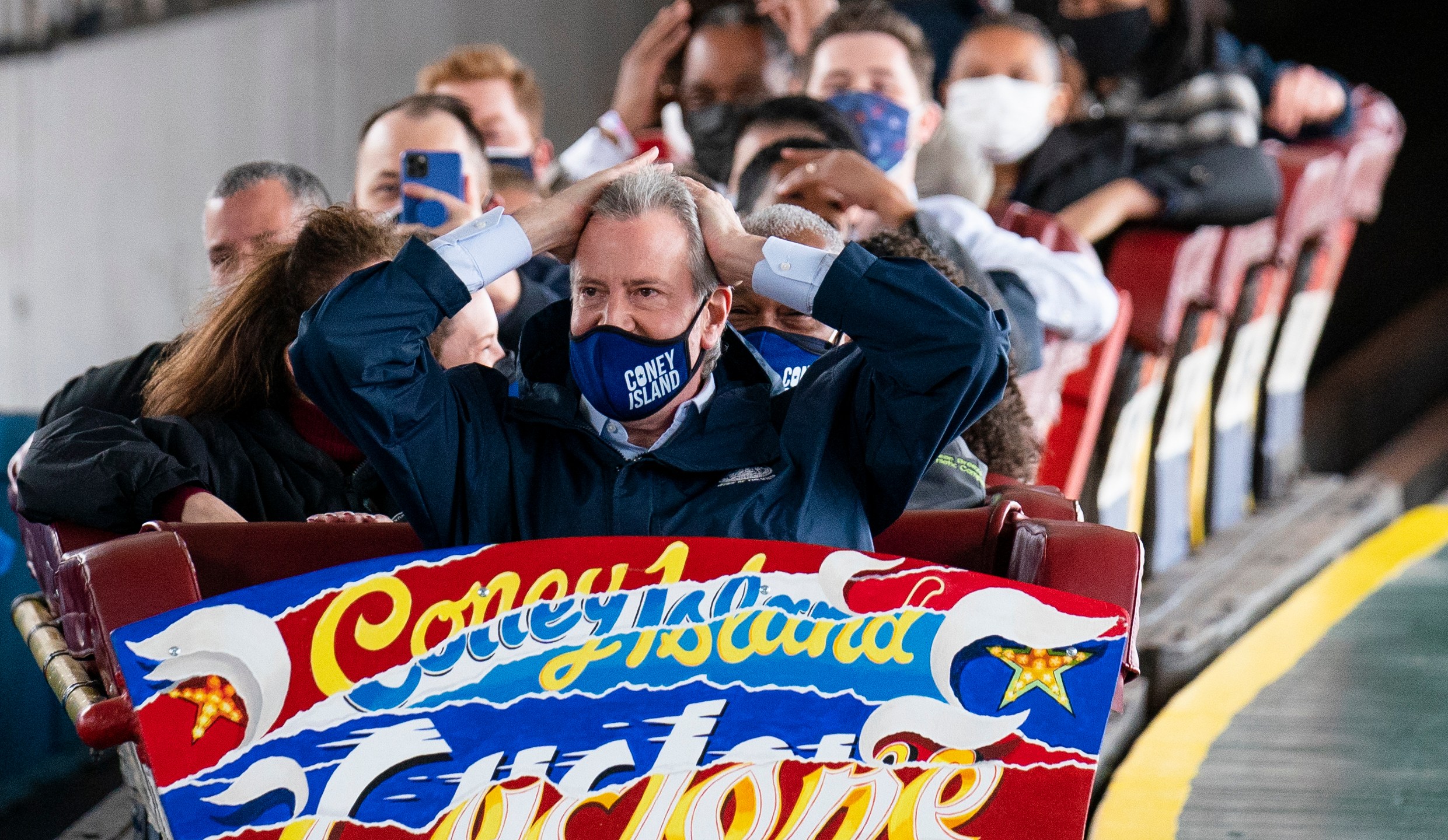 New York City Mayor Bill de Blasio finishes a ride on the Cyclone rollercoaster after attending the ribbon cutting and seasonal opening of the Coney Island amusement park area on April 9, 2021, in the Brooklyn borough of New York. (John Minchillo / Associated Press)