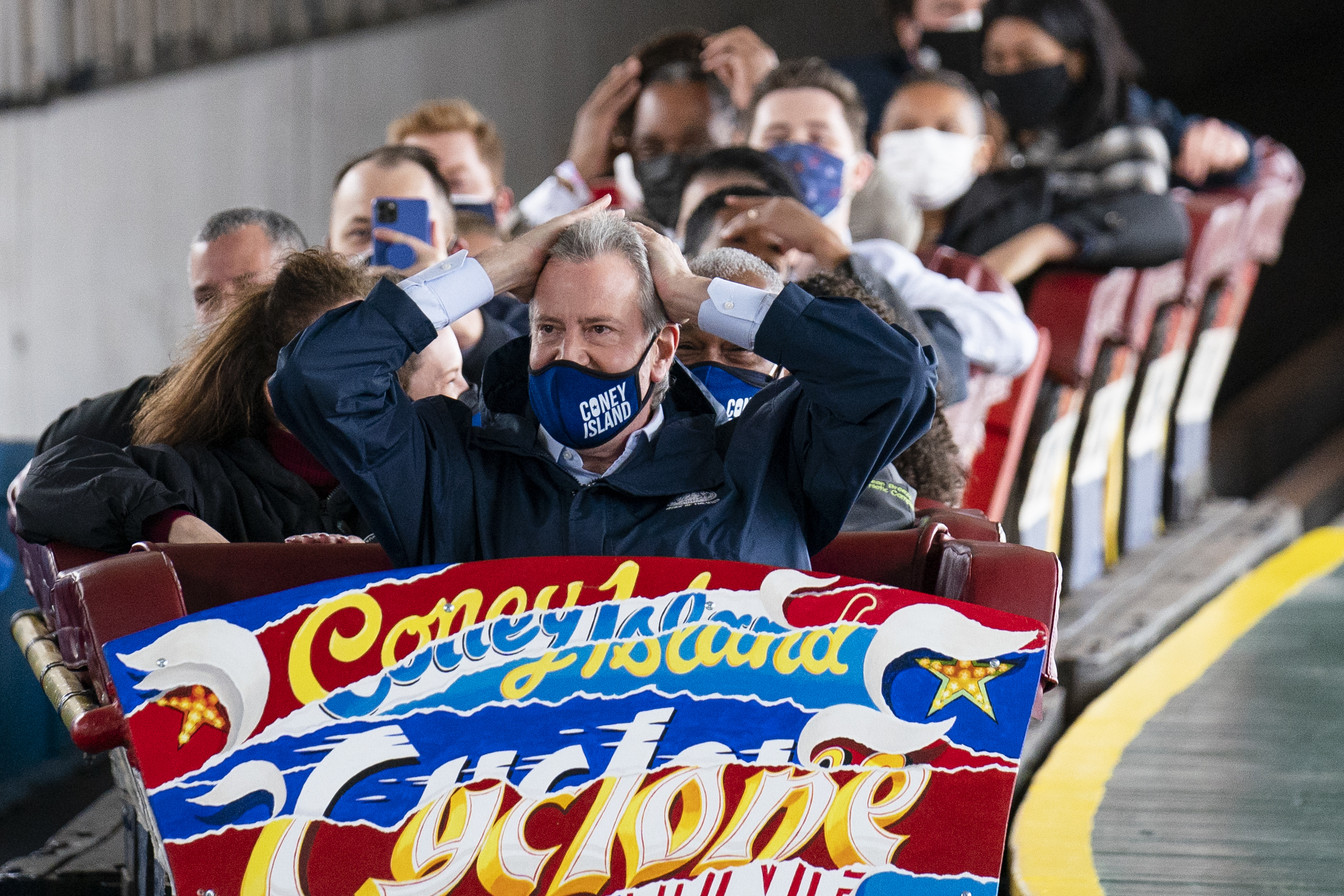 New York City Mayor Bill de Blasio finishes a ride on the Cyclone rollercoaster after attending the ribbon cutting and seasonal opening of the Coney Island amusement park area on April 9, 2021, in the Brooklyn borough of New York. (John Minchillo / Associated Press)