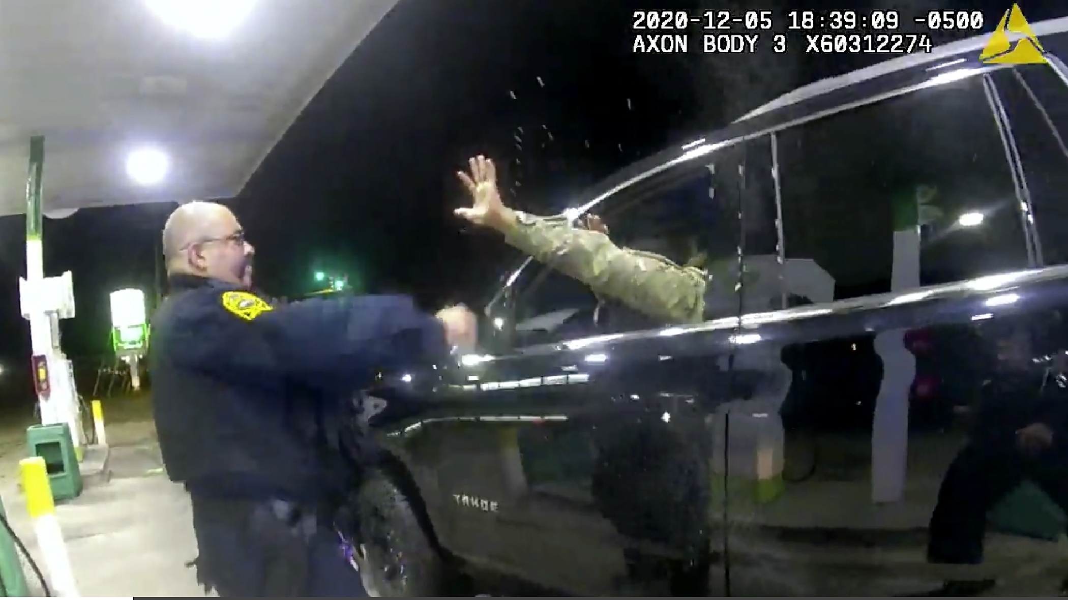 In this image made from Windsor, (Va.) Police video, A police officer uses a spray agent on Caron Nazario on Dec. 20, 2020, in Windsor, Va. (Windsor Police via AP)