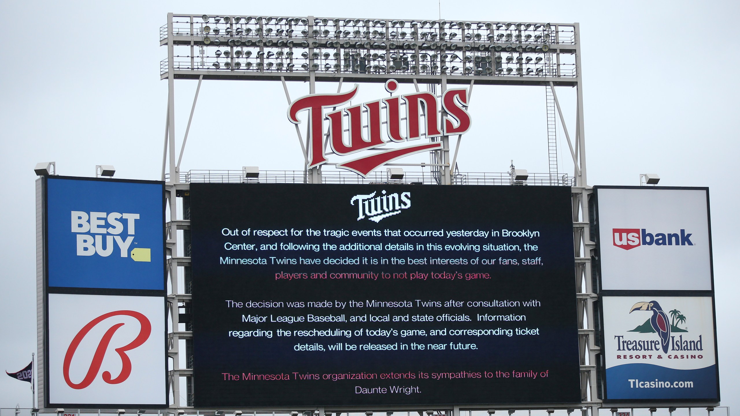 The scoreboard at Target Field explains the postponement of the baseball game between the Minnesota Twins and Boston Red Sox in Minneapolis on April 12, 2021. (Stacy Bengs / Associated Press)