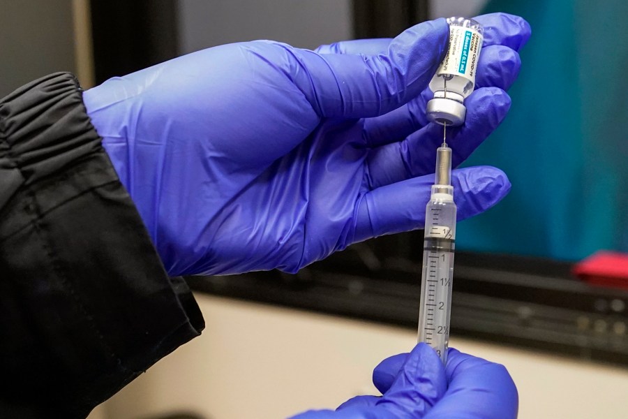 In this March 31, 2021, file photo, a nurse fills a syringe with Johnson & Johnson's one-dose COVID-19 vaccine at the Vaxmobile, at the Uniondale Hempstead Senior Center, in Uniondale, N.Y. U.S. health regulators on Tuesday, April 13, is recommending a “pause” in using the vaccine to investigate reports of potentially dangerous blood clots. (AP Photo/Mary Altaffer, File)